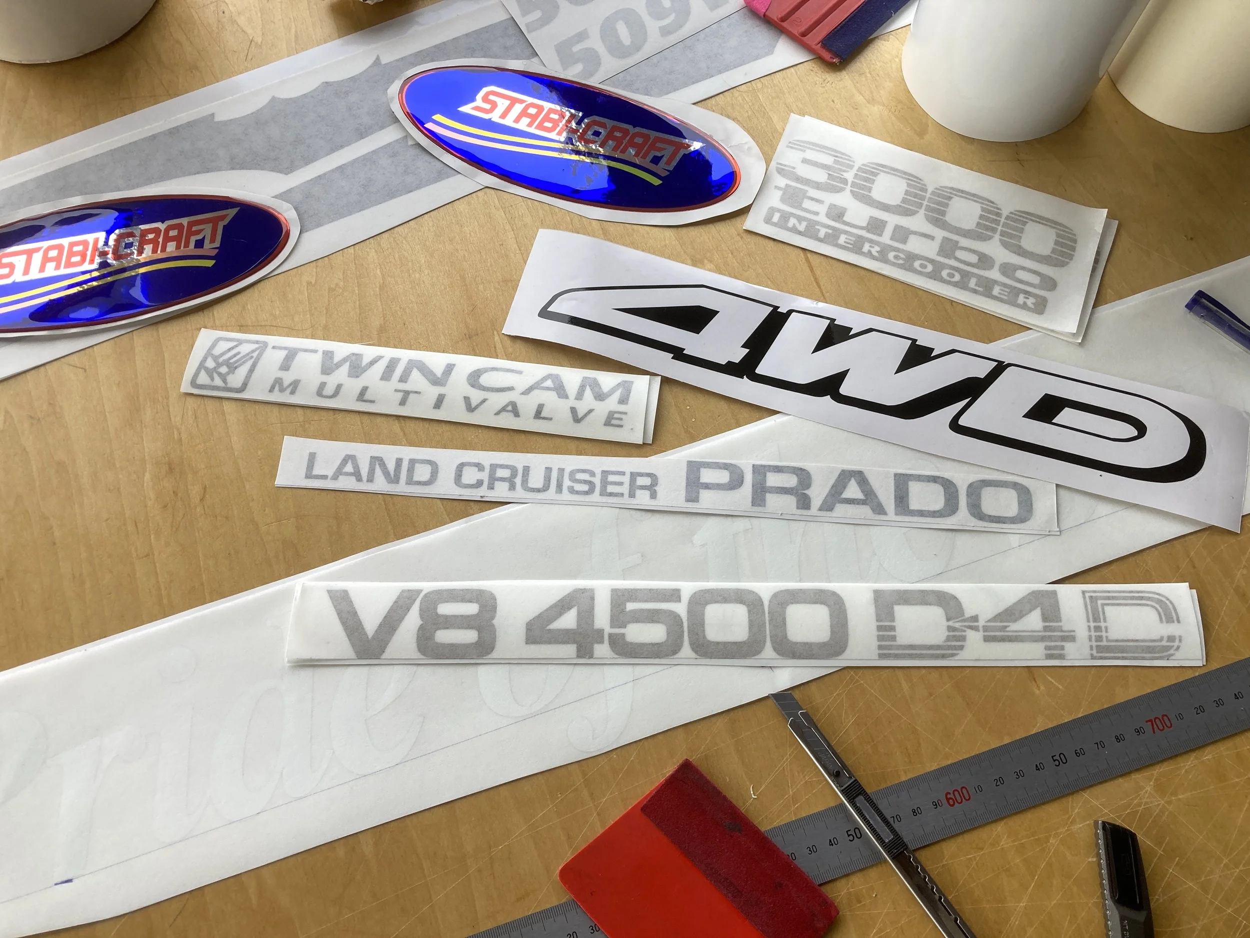 In the workshop, creating vintage and retro boat and vehicle graphics.