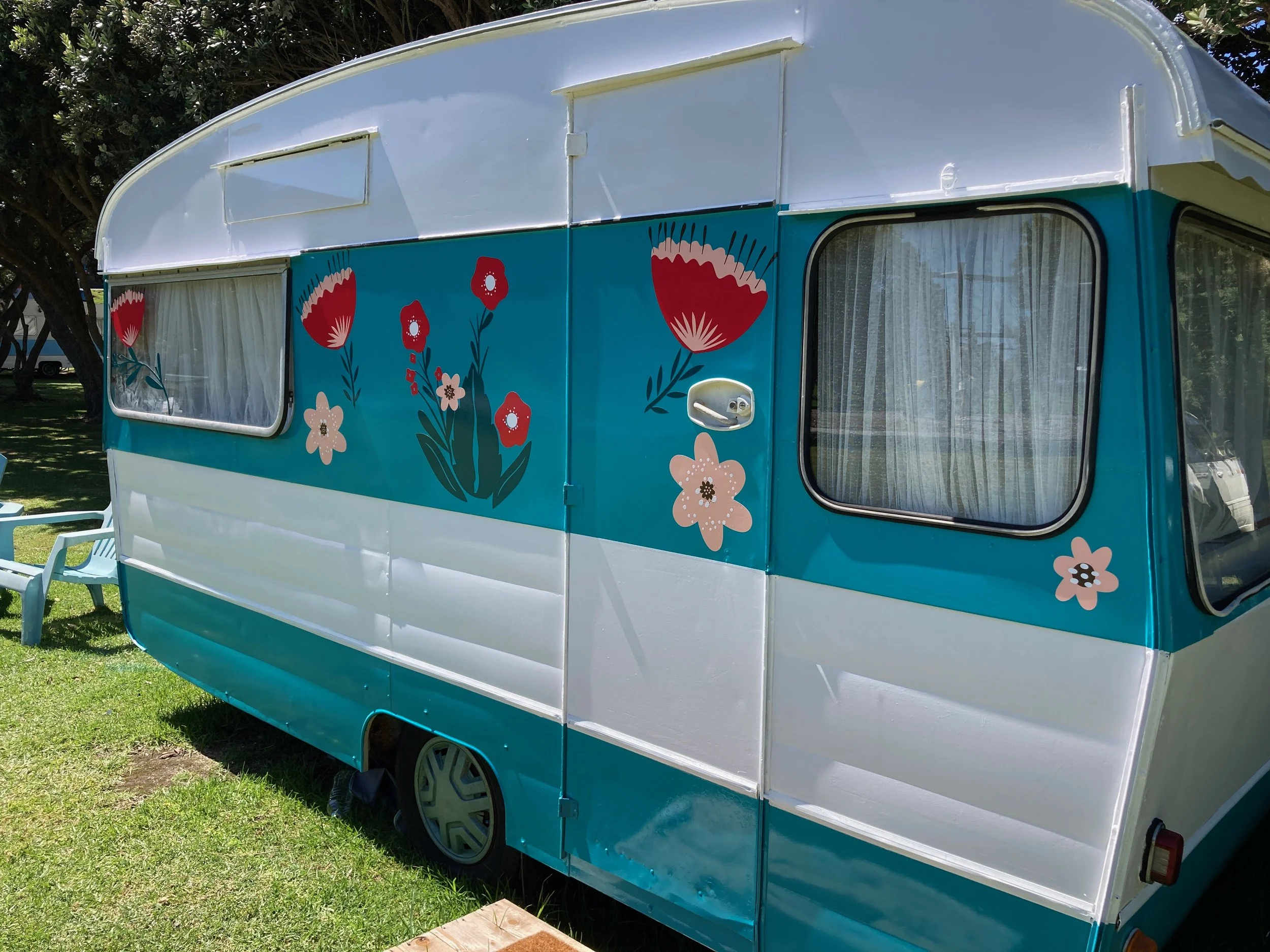 A client wanted to makeover her old caravan - this is a vinyl wrap with custom graphics package.