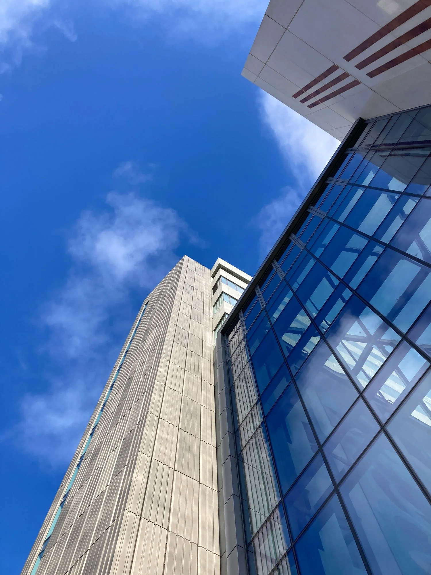 Looking up at University buildings and blue sky, Glasgow