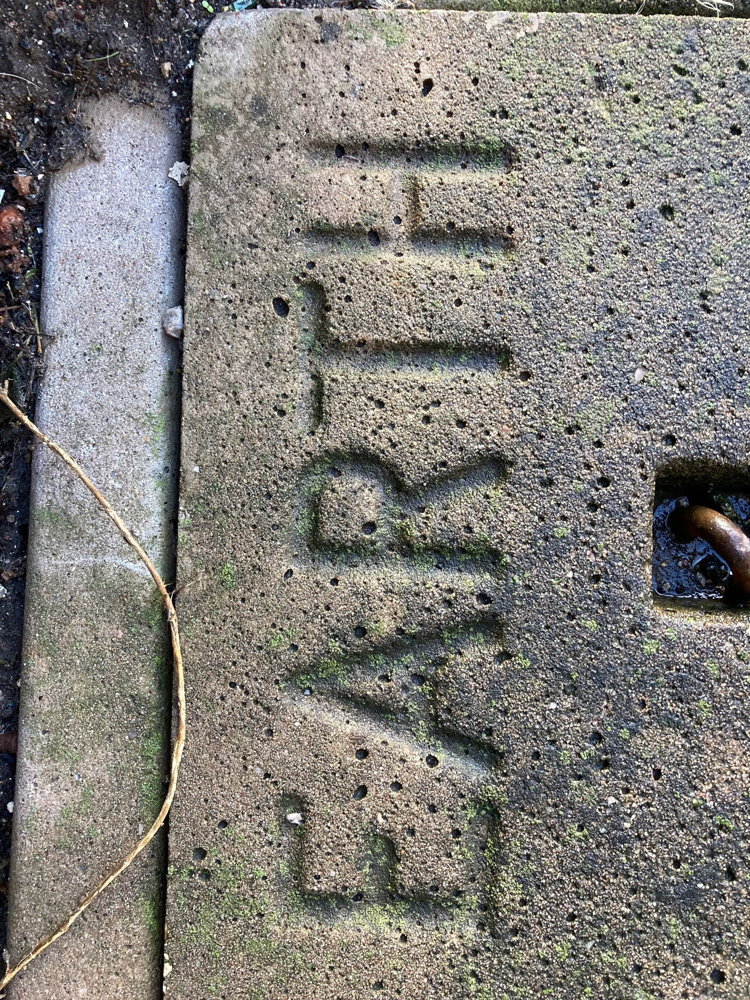 Earth written on stone block