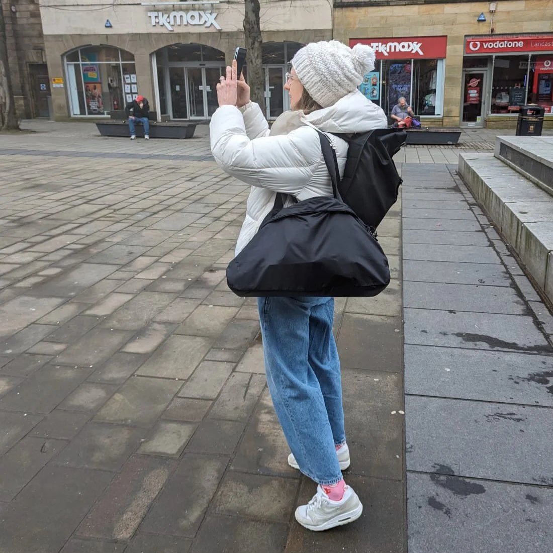 Yo taking a photo on her mobile phone in Lancaster