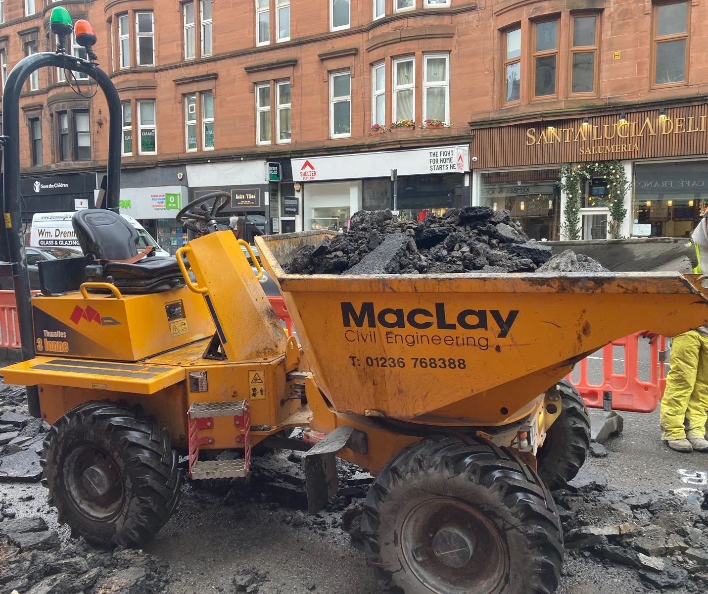 Construction on Byers Road Glasgow, Yellow Dumper truck