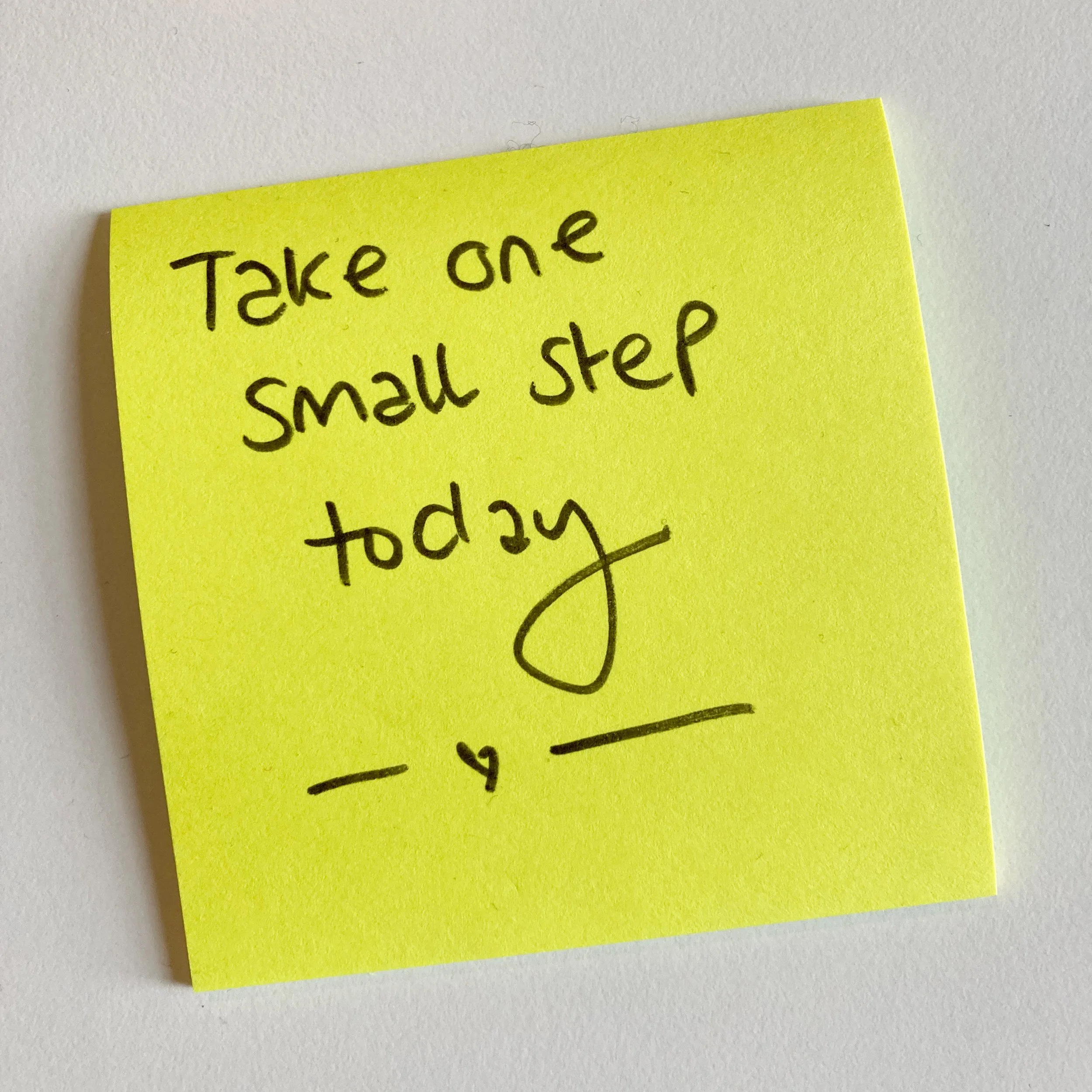 Post it note with text Take one small step today
