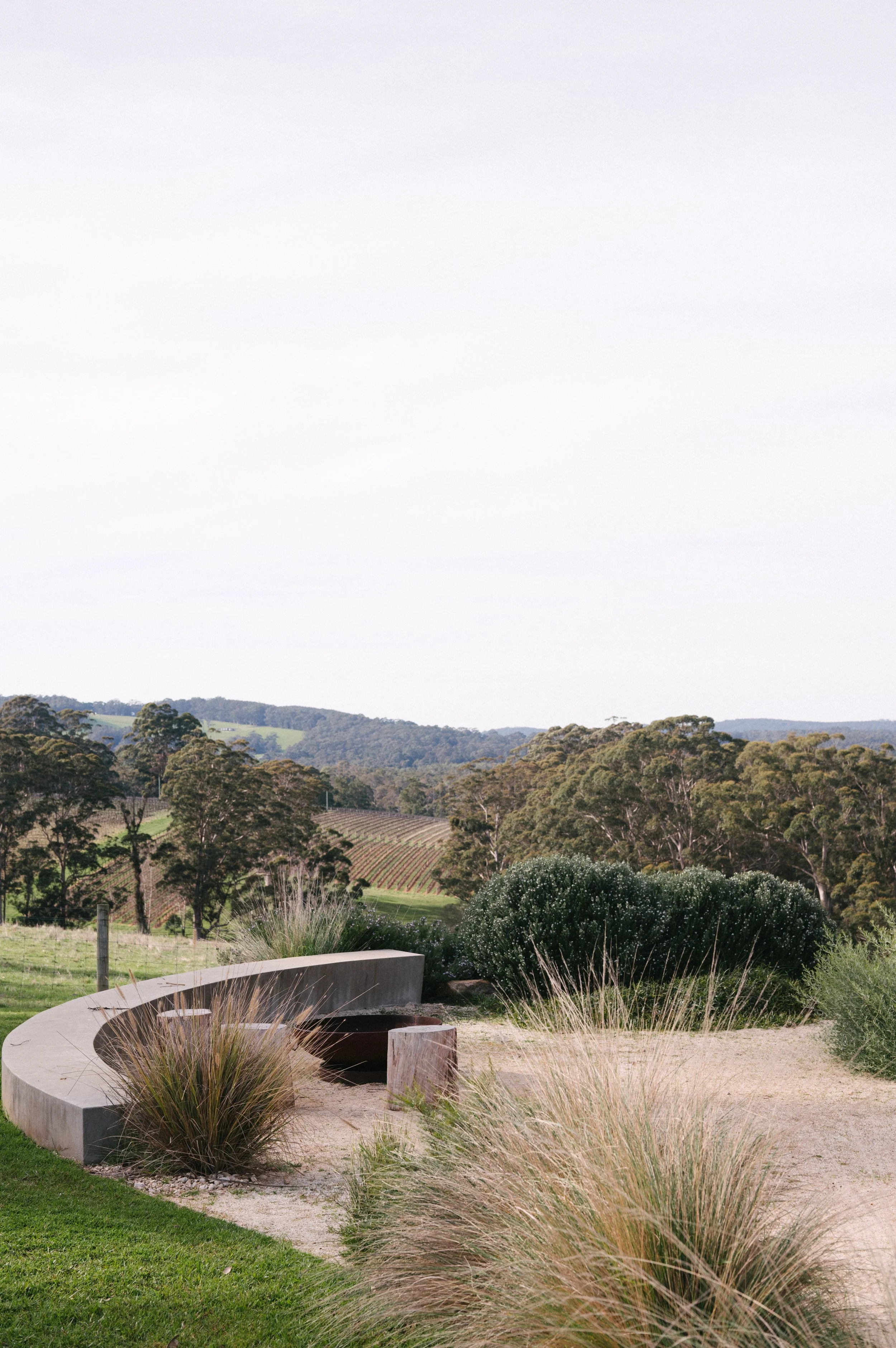 Lush gardens near Cabin Vine at Upland Farm, overlooking the neighbouring vineyard and rolling countryside in Denmark, Western Australia.