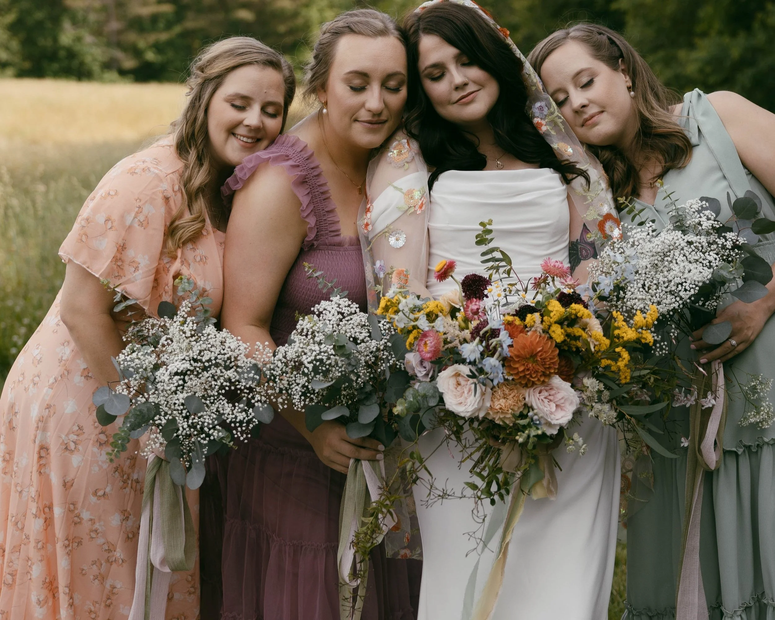 Bride with maids wild flower wedding in NC foot hills field