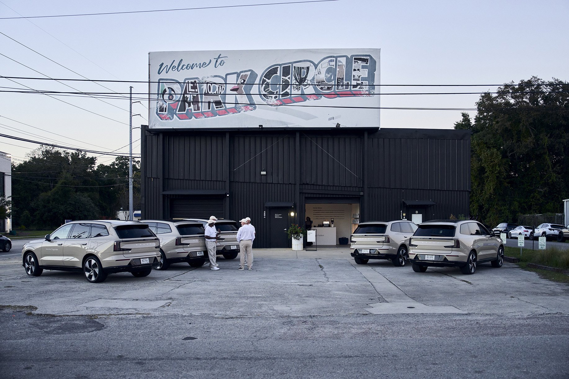 Parking lot outside Silver Hill Studio with billboard 'Welcome to Park Circle.'