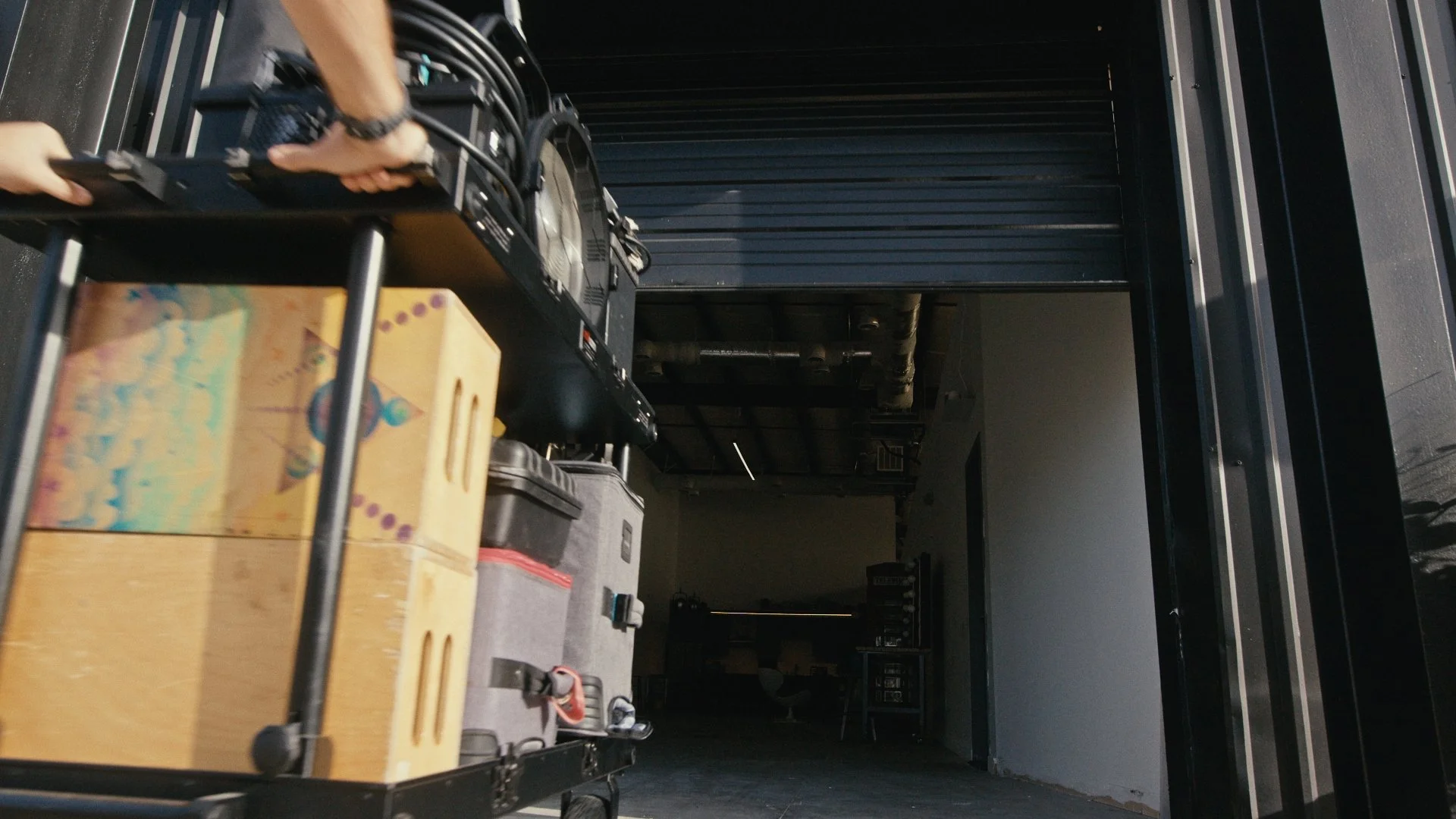 A camera cart  being rolled into Silver Hill Studio's easy load in /load out garage door.