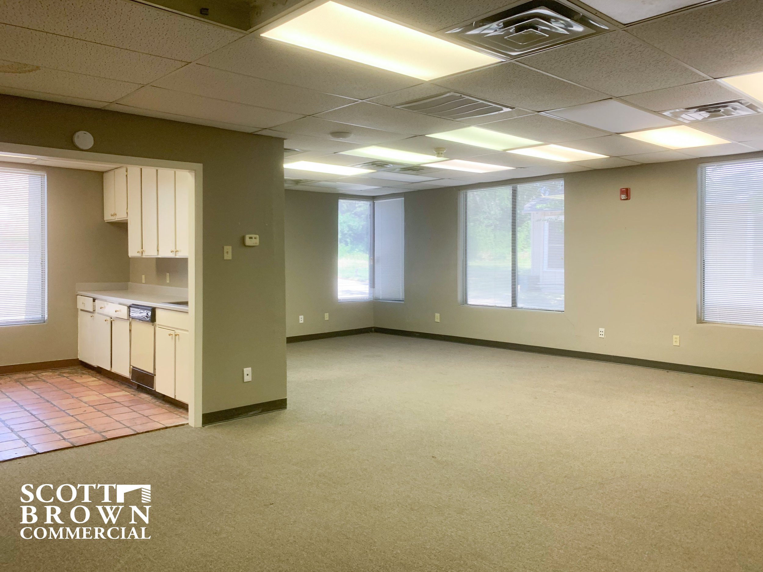  office space with open break room to the left within 400 S Carroll Boulevard 