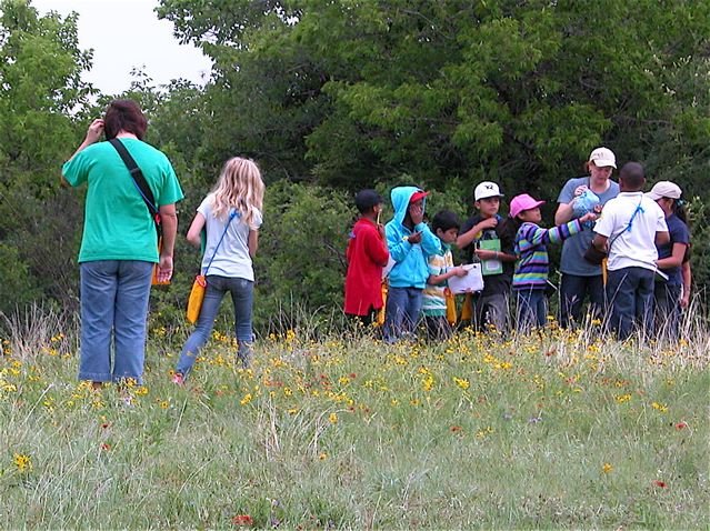   Heather Foote , in April 2011, leading a gaggle of 4th graders at the FOTHNA-funded,&nbsp; Kids on the Prairie . 