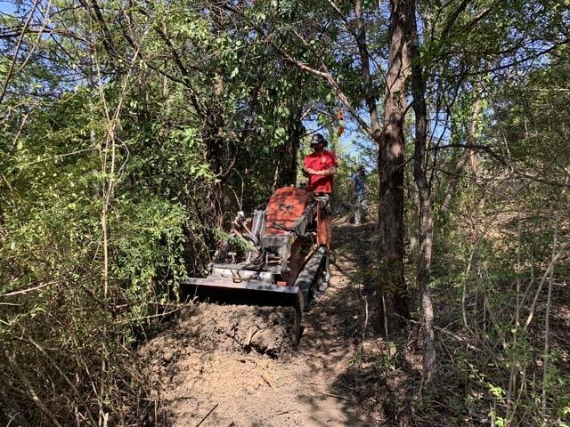   Ryan Spates &nbsp;of&nbsp; S&amp;S Trail Services , becomes one with his machine as it carves&nbsp;scenic, new trails. 