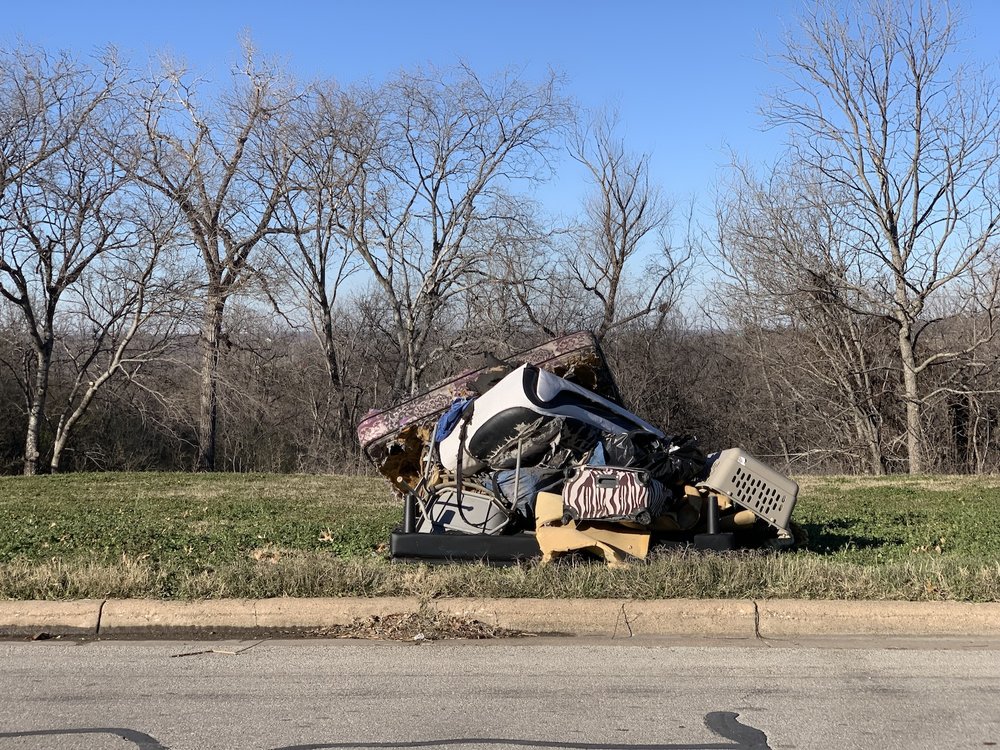  A recent pile of trash left behind from a homeless camp. 