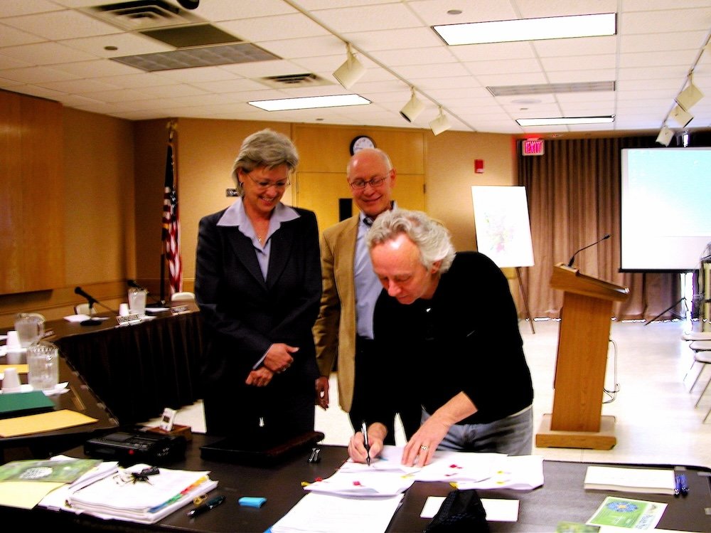  Don Young signing a partnership agreement with FW Park &amp; Rec in 2010. Melody Mitchell and JIm Marshall, look on. 