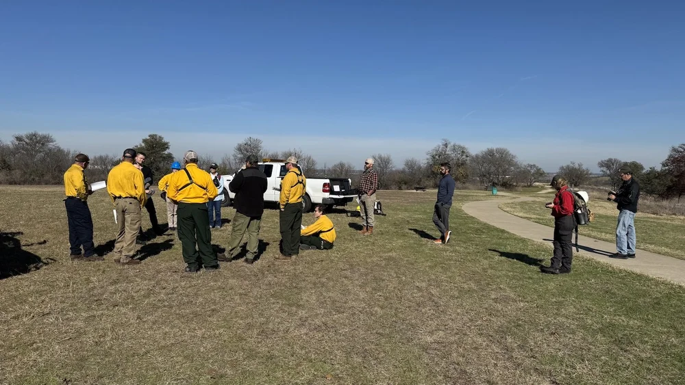  Jared Hall explaining the plan of action to his crew members. 