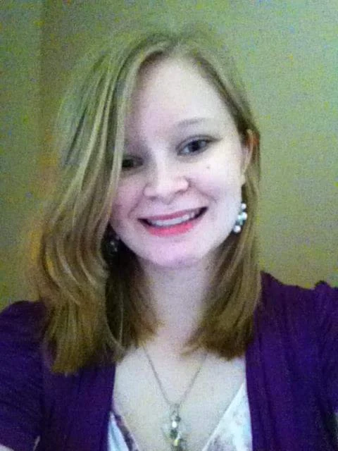 Lori Adams as a white blonde haired teenager, smiling at the camera