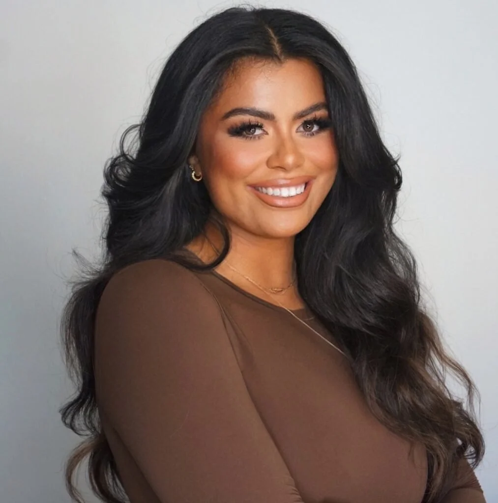 Picture of Drew Afualo, a Samoan woman, smiling warmly at the camera