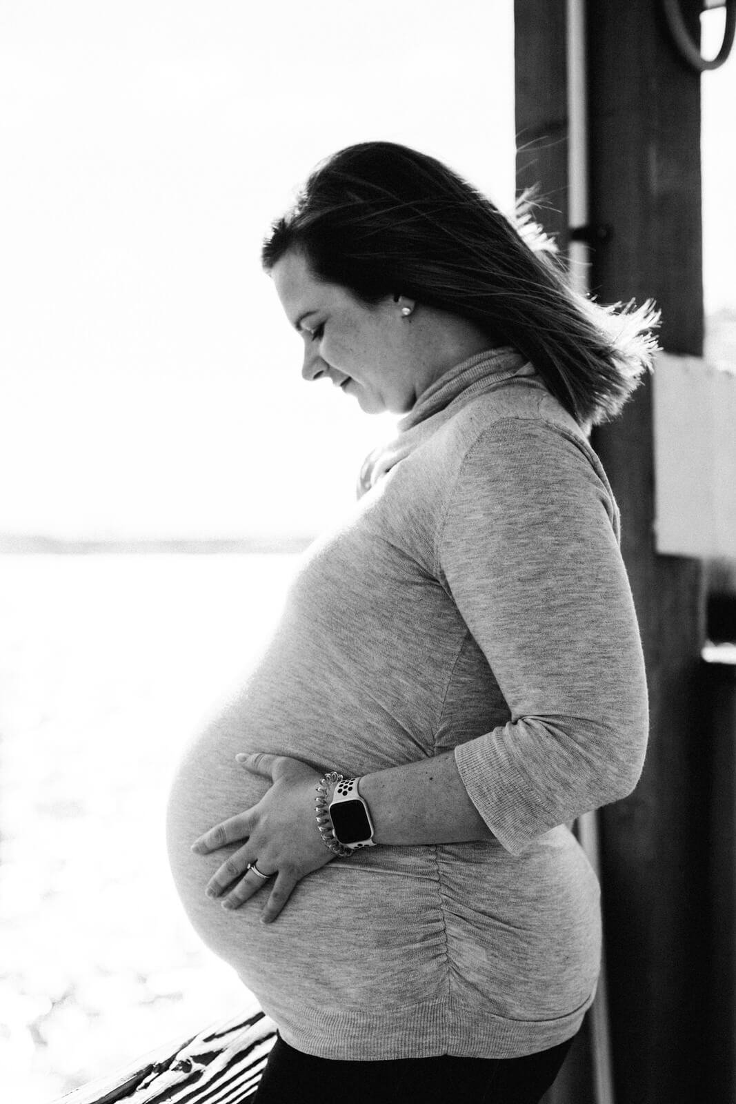  Black and white photo of the profile of a pregnant woman for a Washington DC maternity photoshoot 