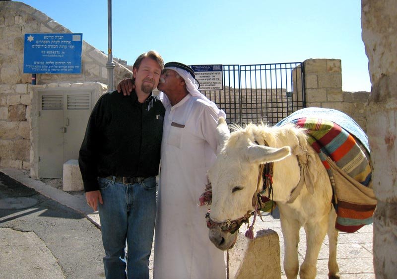 Fr. Houk, a friend, and a donkey