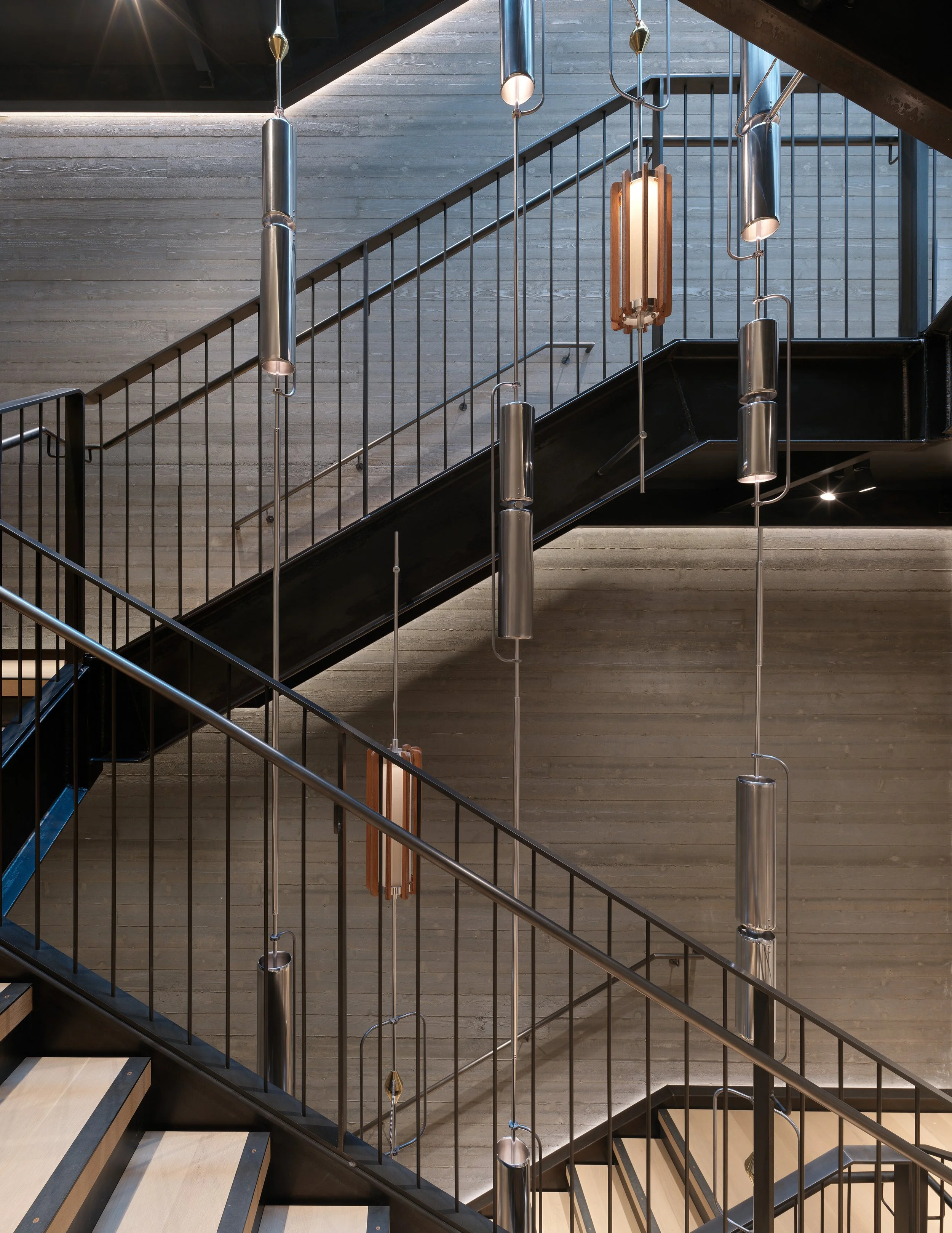 Four stories of interior board formed concrete in a Belltown commercial adaptive reuse project. Architect: Graham Baba Architects