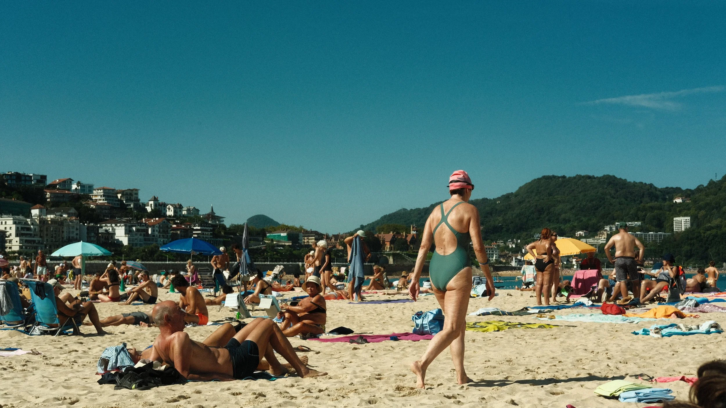  This is Kontxa Hondartza (Playa de la Concha), San Sebastián. This town is in the Basque Country of Spain, so many of the writings are in the Basque Language.   