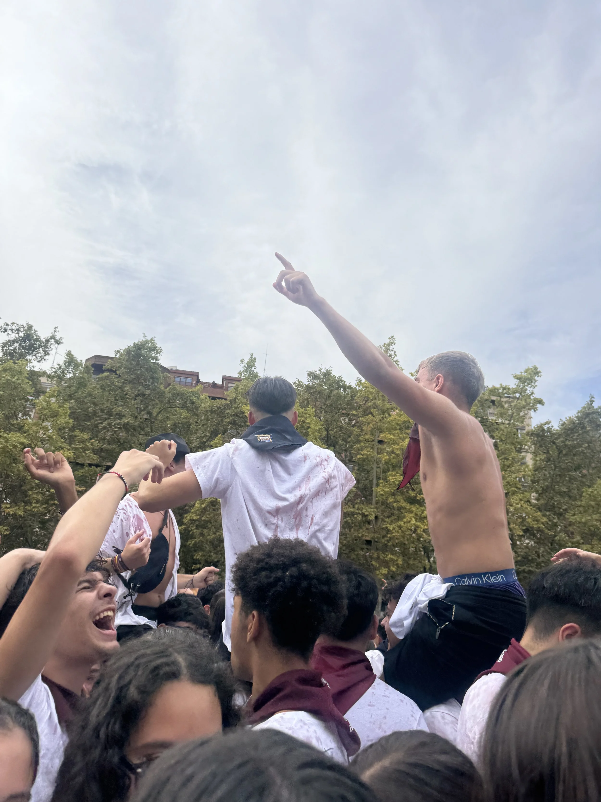  The next day was the  chupinazo  in front of the town hall. At this event, the mayor spoke from the windows and everyone wore their  panuelos  and drank wine while throwing it at other people. 