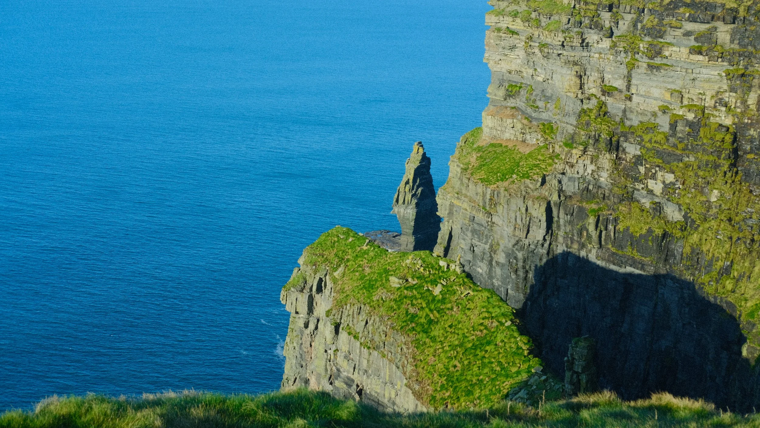  The cliffs were rocky, and the brutal wind made the waves crash into the side. Every sight looked almost impossible to be natural. 