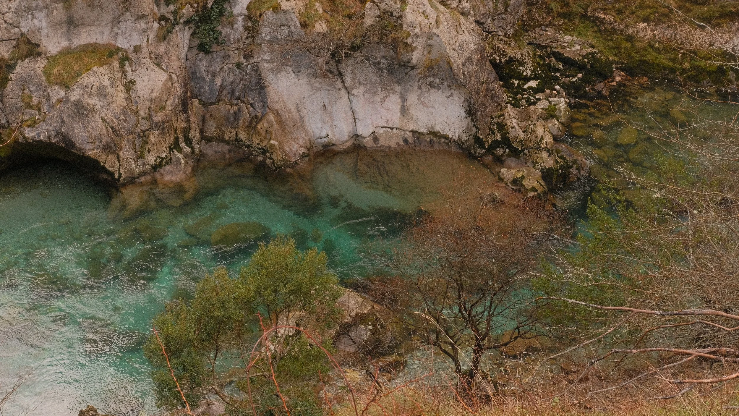  In the national park the mountains parted ways just like they did on the drive there. At the bottom, in the valley, laid a turquoise blue river flowing. The only noise besides our boots was the rushing water and an occasional goat sound. 