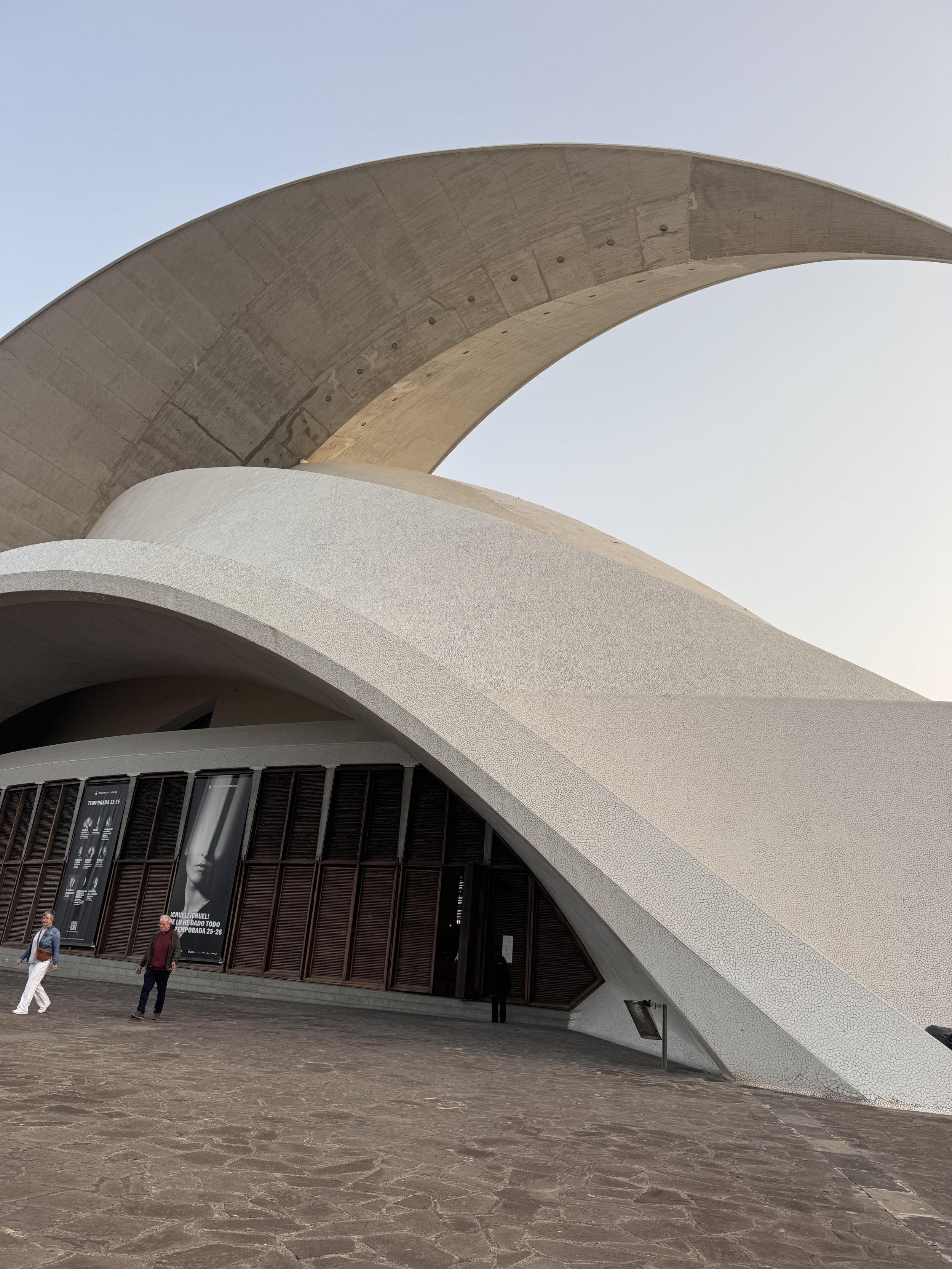  There is an opera house in Tenerife that resembles the one in Sydney with the white structural wave architecture.  
