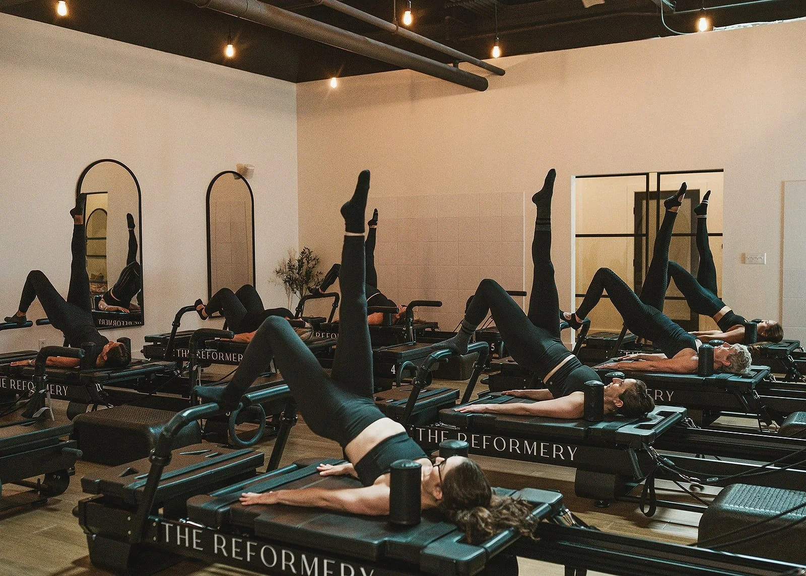 Women participating in Pilates reformer classes in Candaigua
