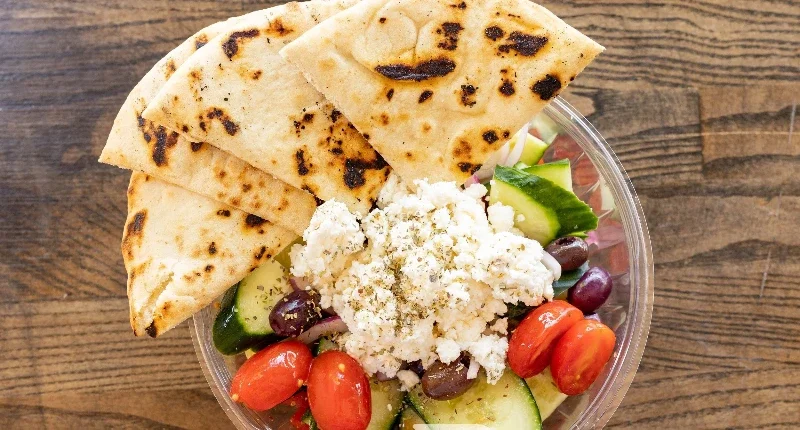 Greek salad with feta, pita, onions