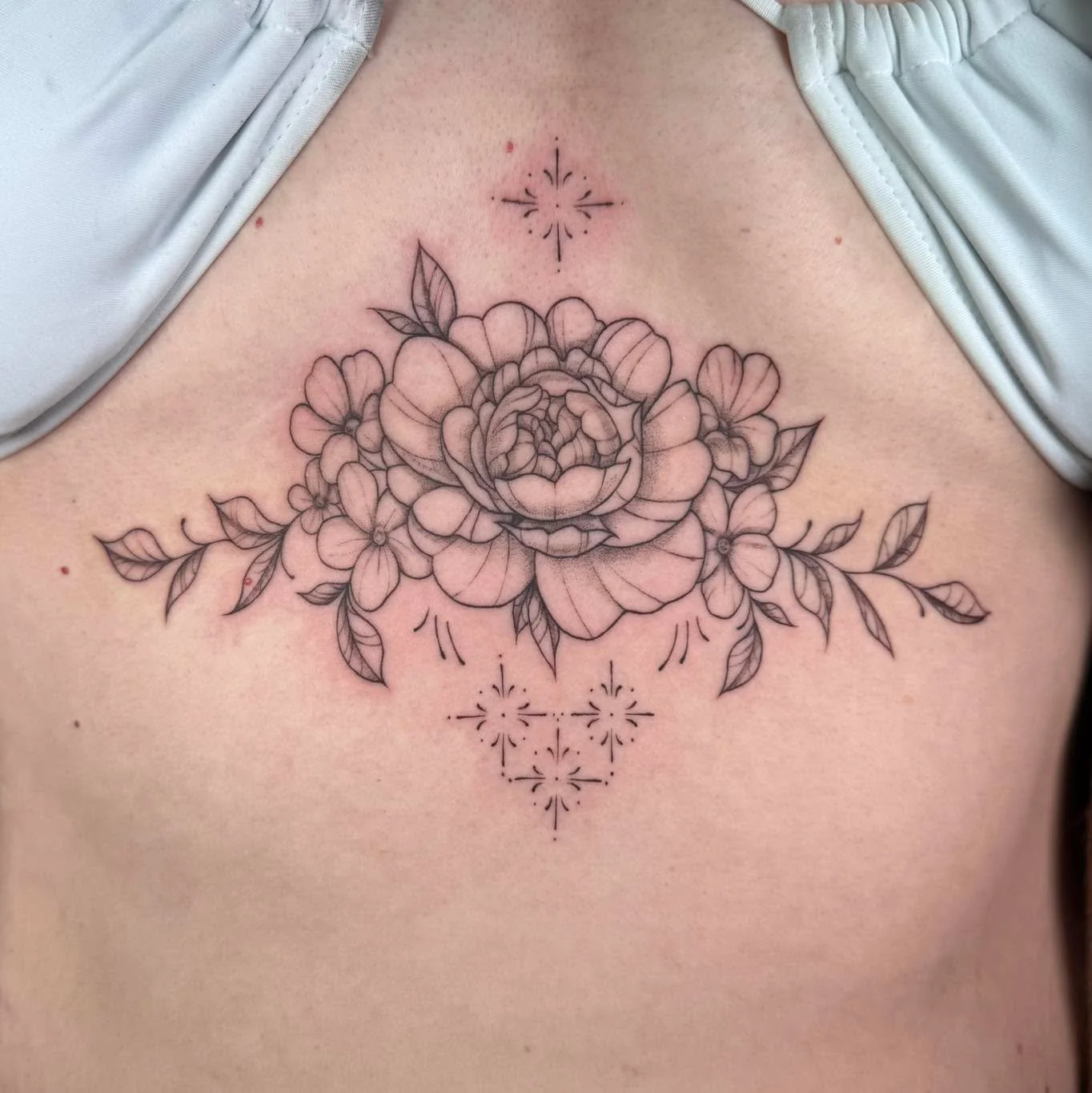 Sternum florals 🌼  #finelinetattoo #femaletattooartist #MadisonWI