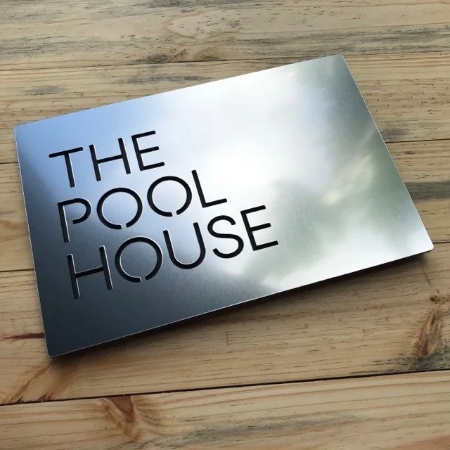 30x20cm internal house sign, brushed silver with black letters.