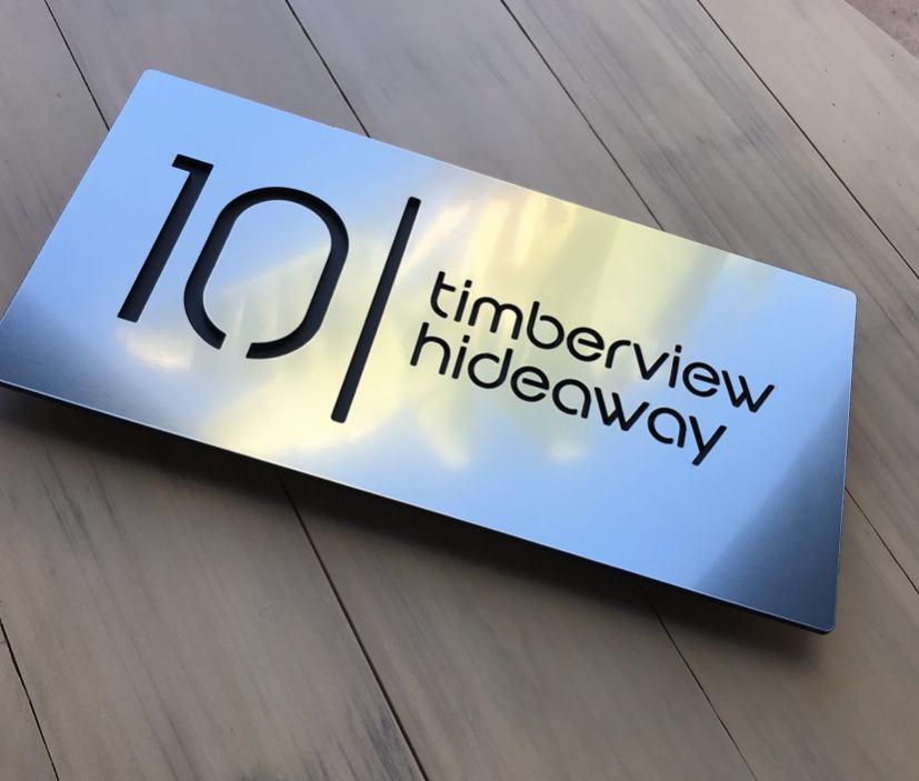 30x15cm House sign, brushed silver with black letters.