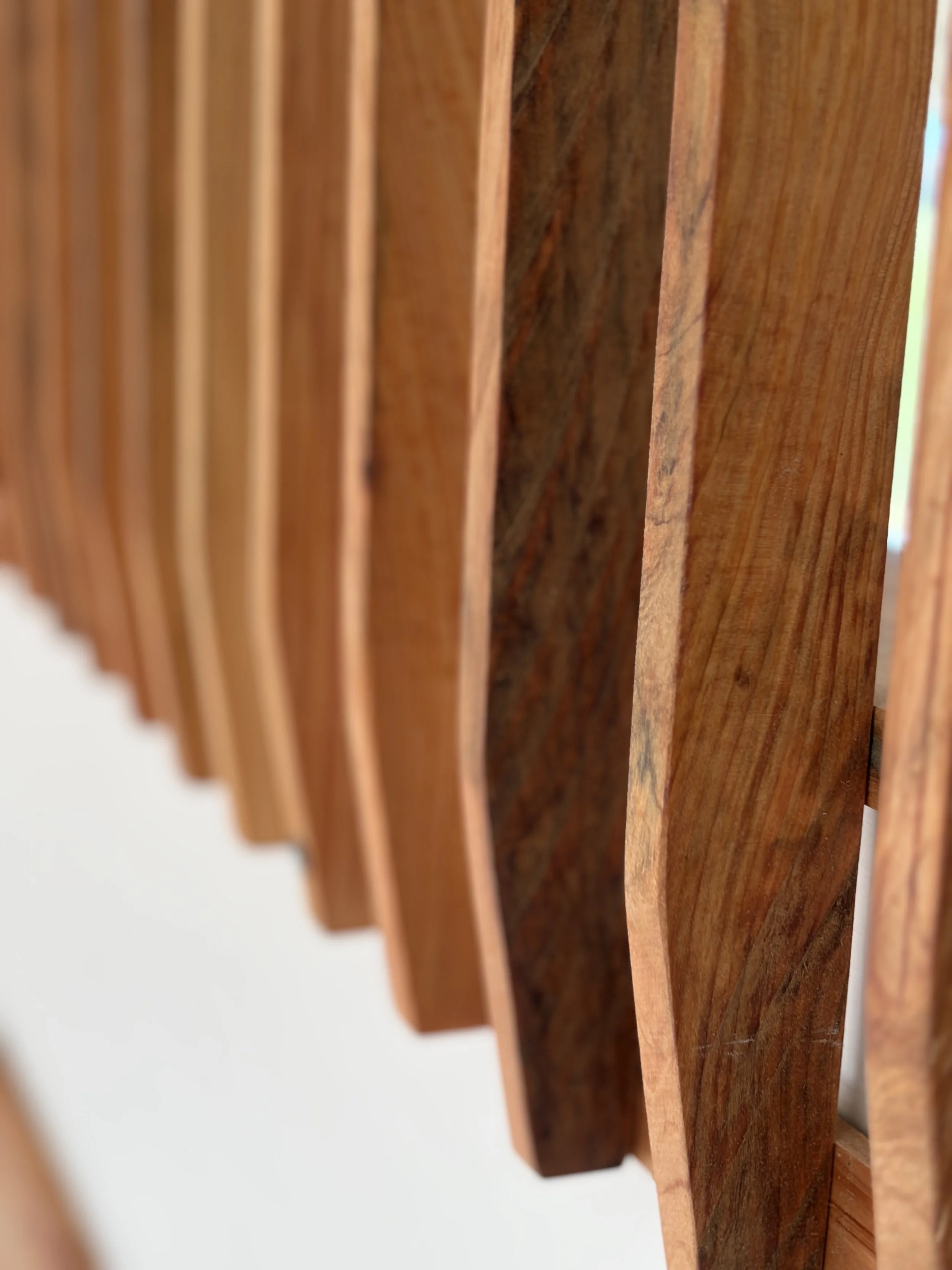 Close-up of natural timber slats showing rich wood grain texture and craftsmanship