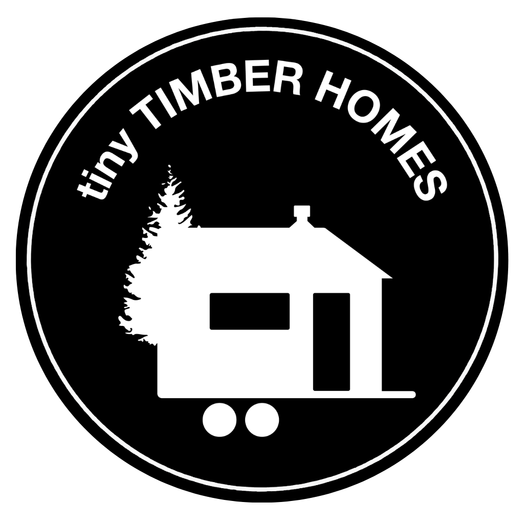 Tiny Timber Homes circular logo badge featuring a tiny house on wheels beside a pine tree