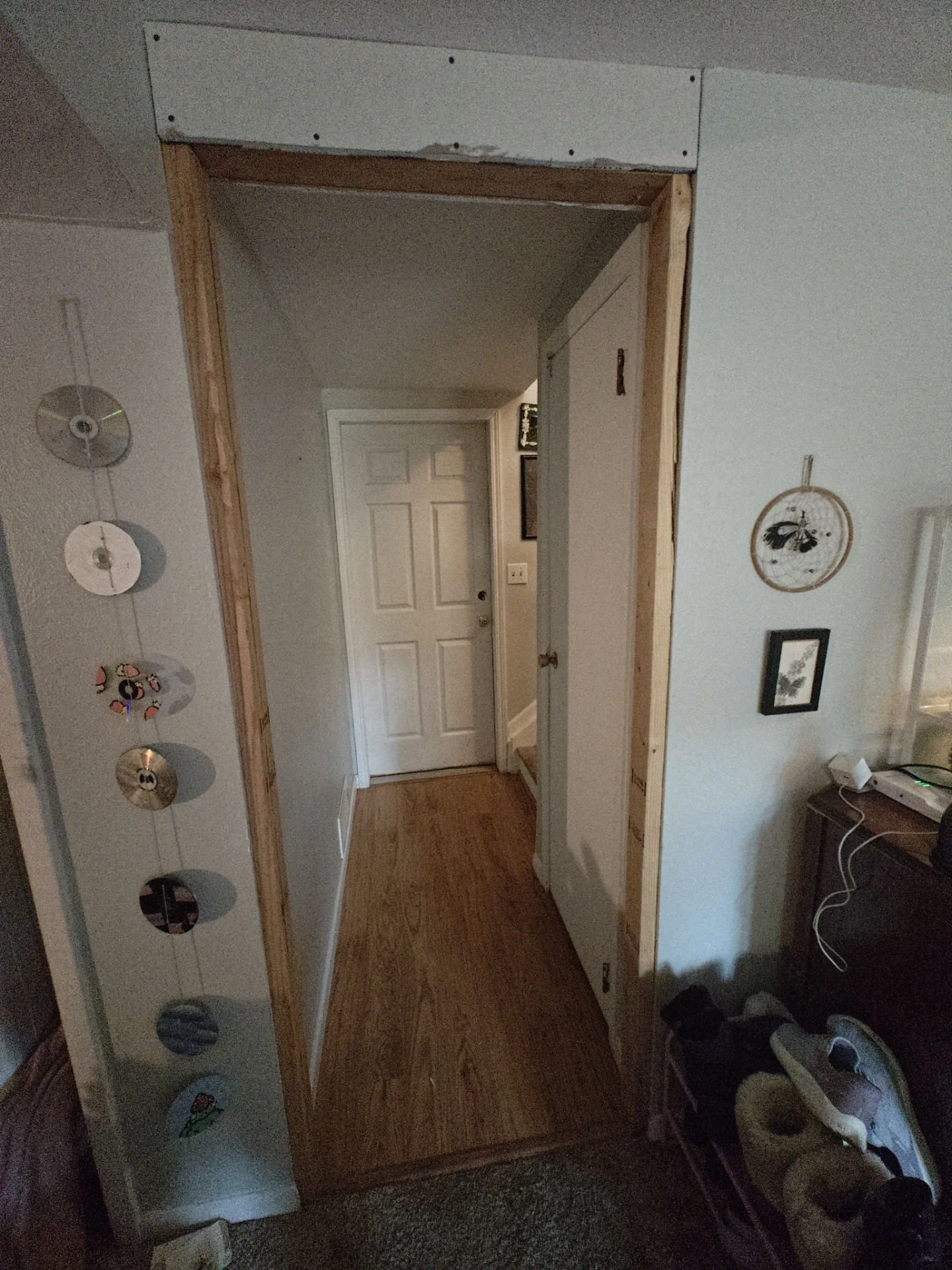 New non-load-bearing framing at the end of an Arvada basement hallway for a 28-inch door