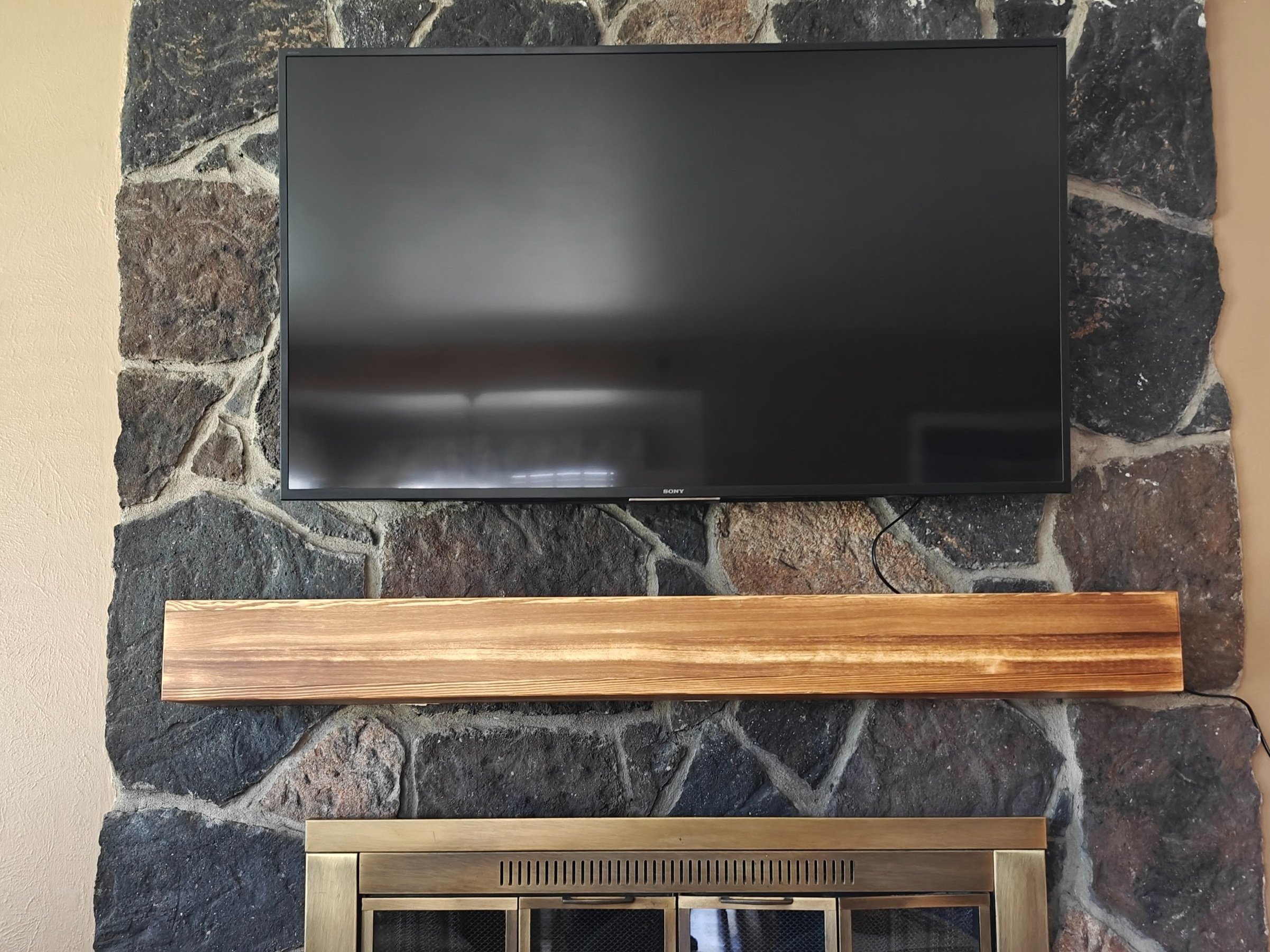 Professionally mounted flat-screen TV in an Arvada living room