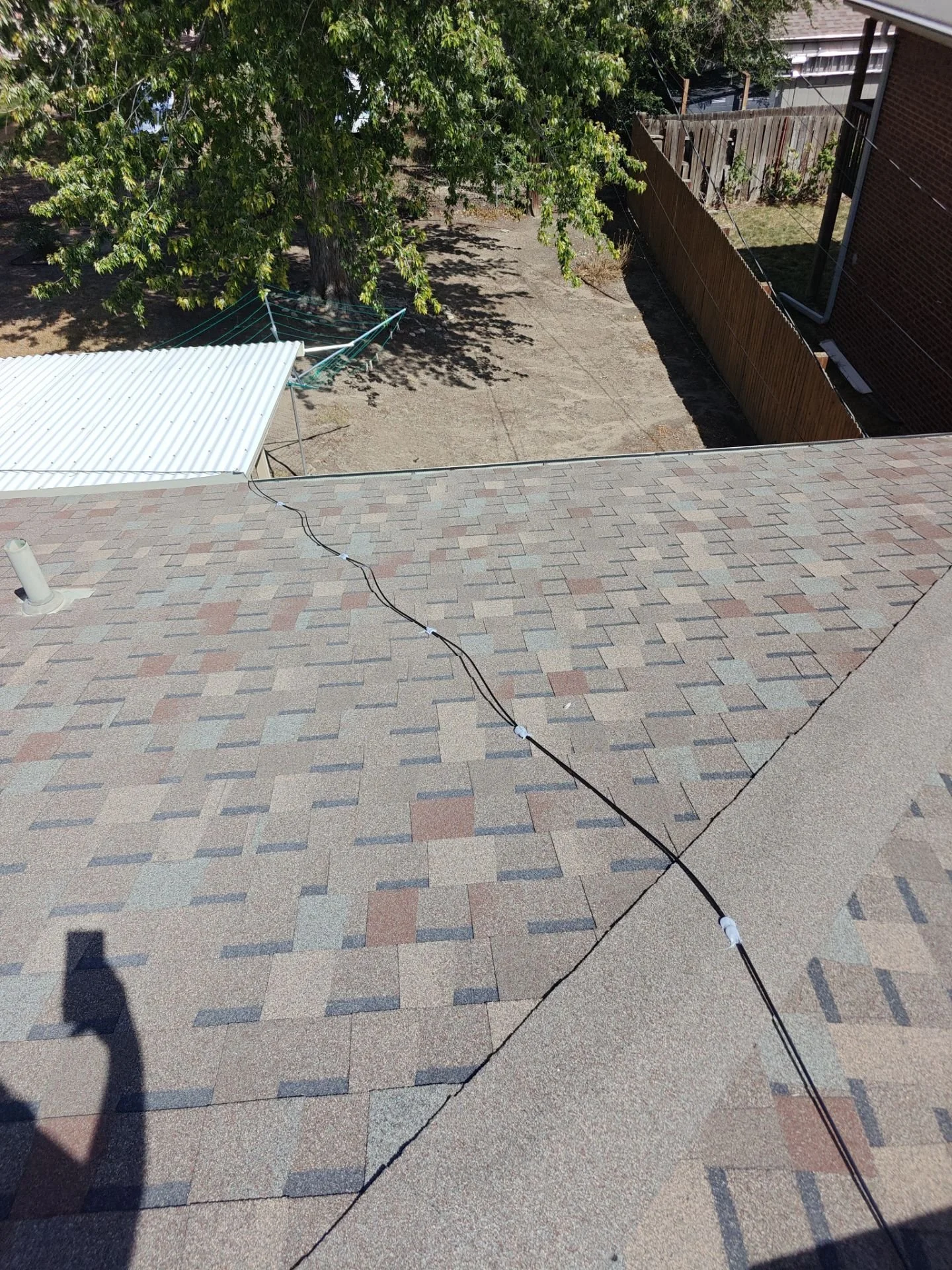 Swamp cooler and roof area after exterior poly water line replacement by Arvada Handyman in Wheat Ridge, CO.