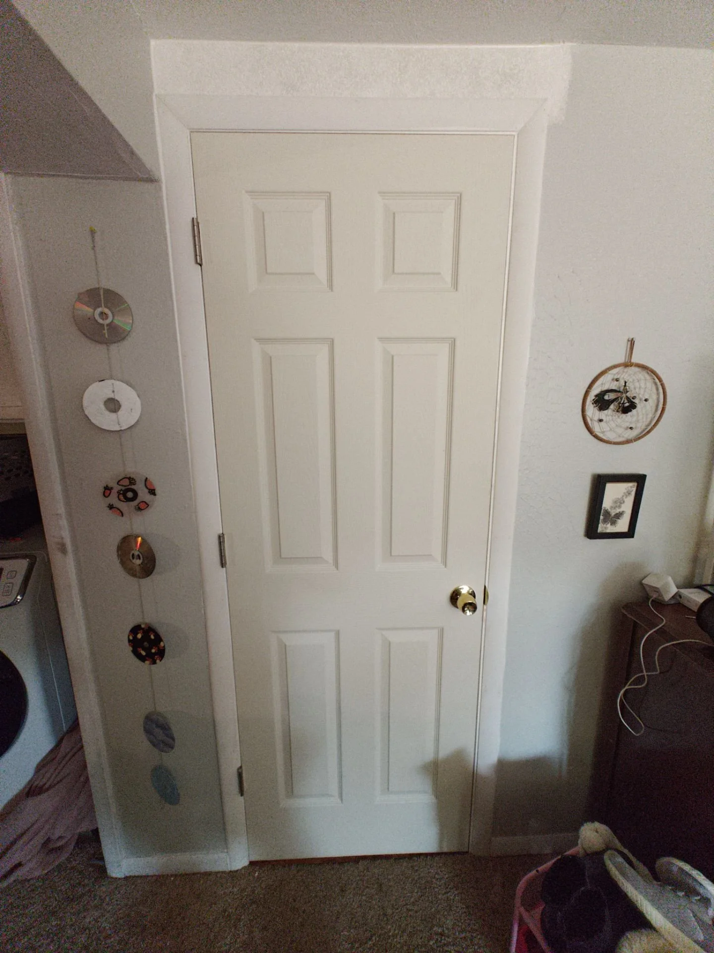Completed basement hallway door installation in Arvada with matching casing and baseboard before homeowner painting.