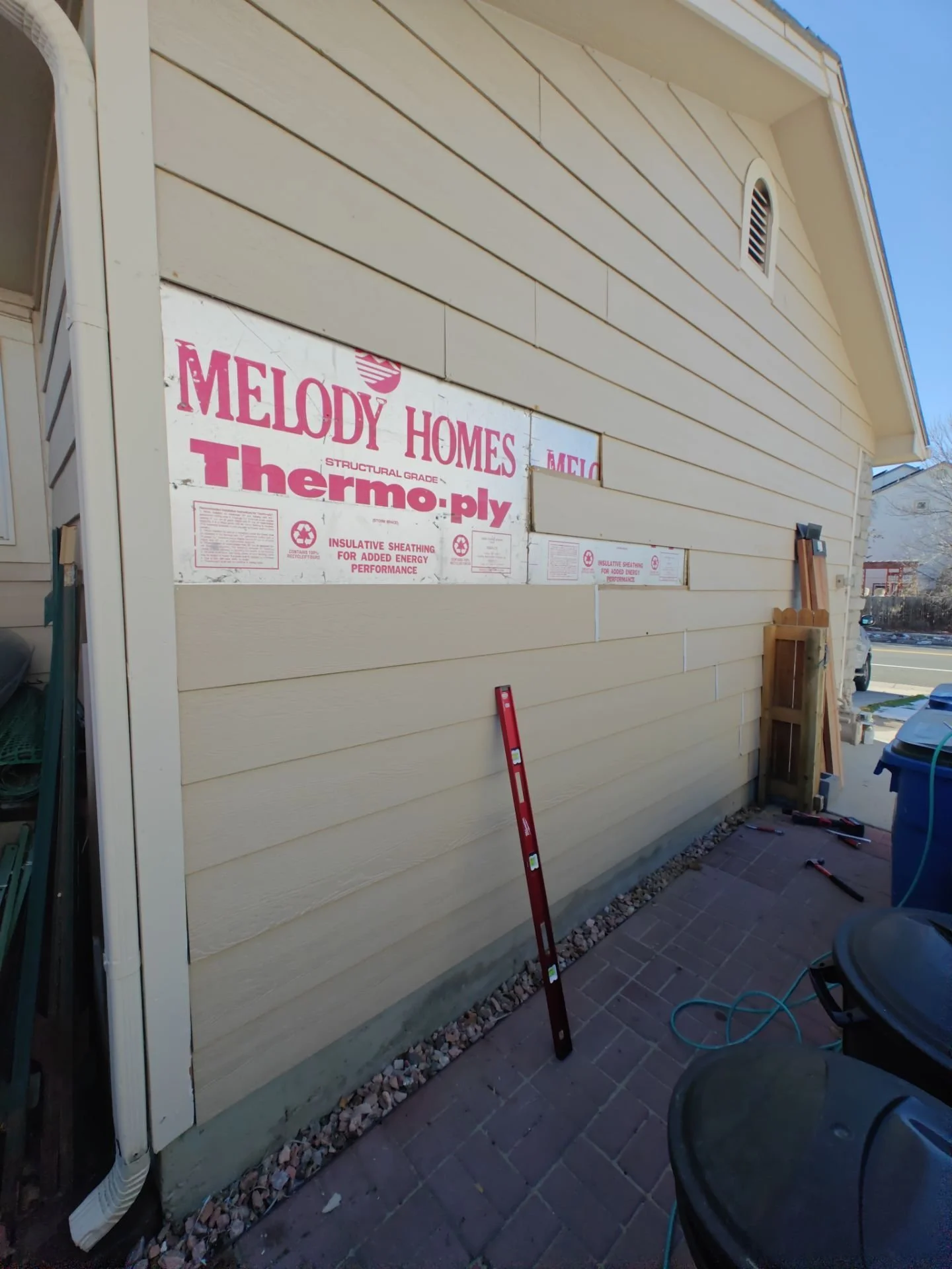 Arvada Handyman repairing damaged siding on a home in Arvada, Colorado