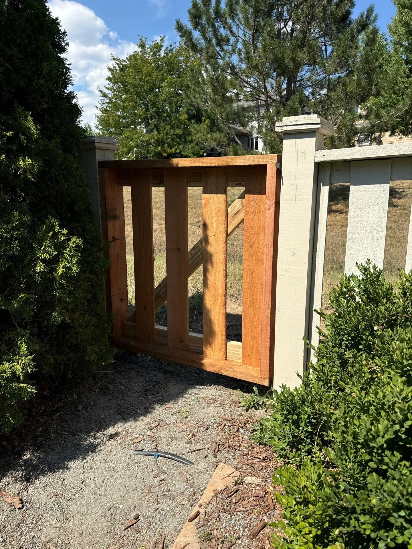 Cedar walk-through gate custom-built between existing fence posts