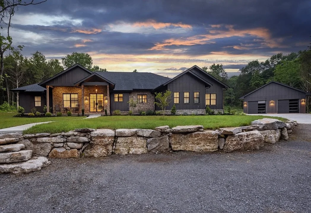 If you&rsquo;re building or remodeling in 2026, this is your sign to add a little drama with a dark exterior.

A dark exterior doesn&rsquo;t hide&mdash;it commands.

From daylight to nightfall, every angle of this black + brick home was designed to m