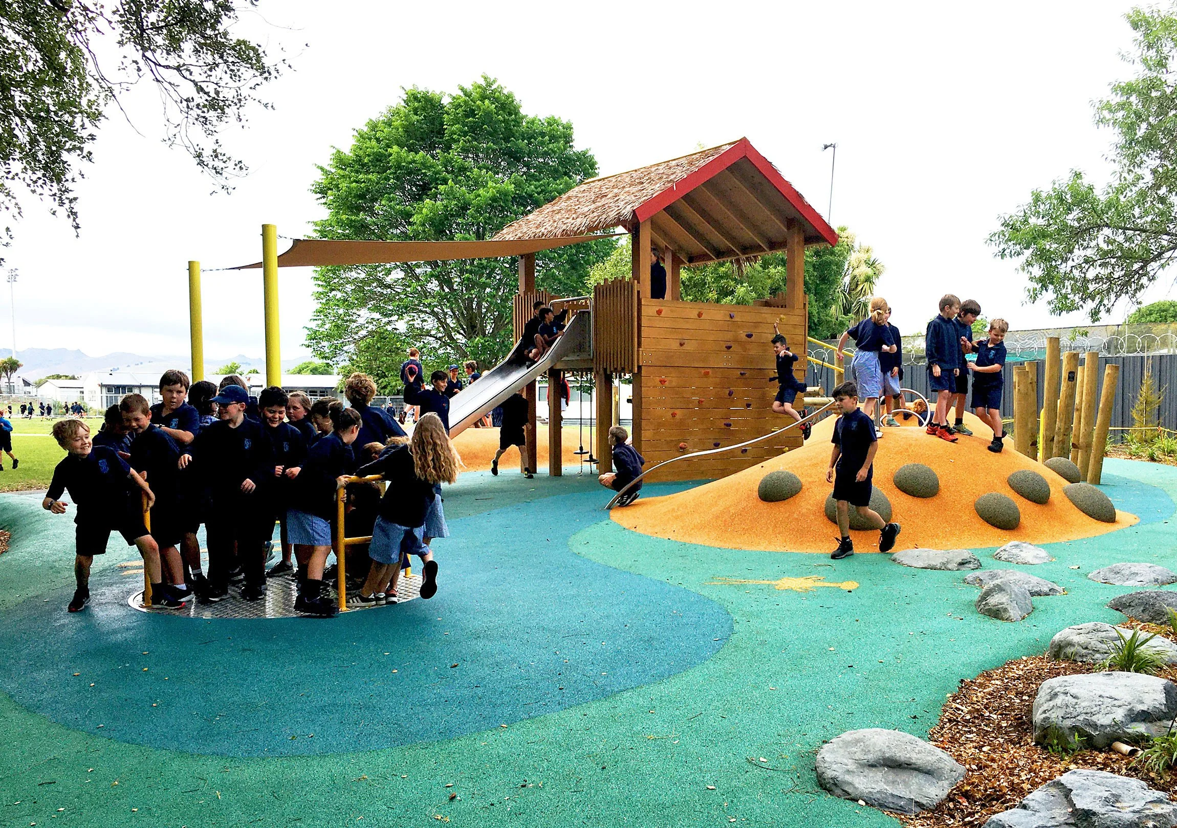 Merry-go-round in school playground by Botanic Landscape Architects in St Albans, Christchurch
