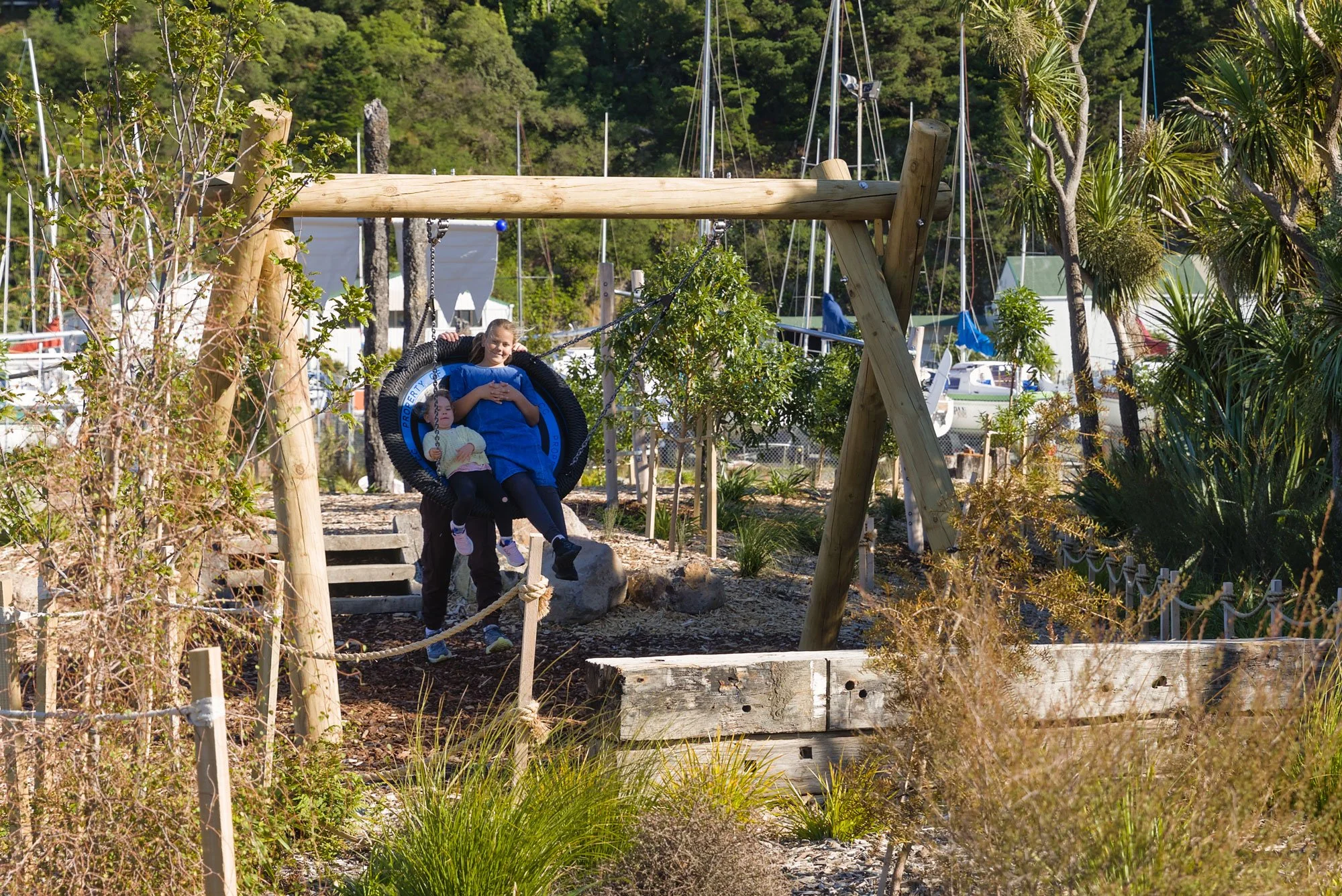 Natural materials in play, integrated into planting by Botanic Landscape Architects in Lyttelton, Christchurch