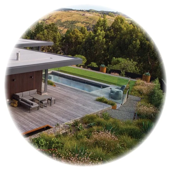 A Port Hills garden with a terraced deck, swimming pool and lawn - a perfect family garden