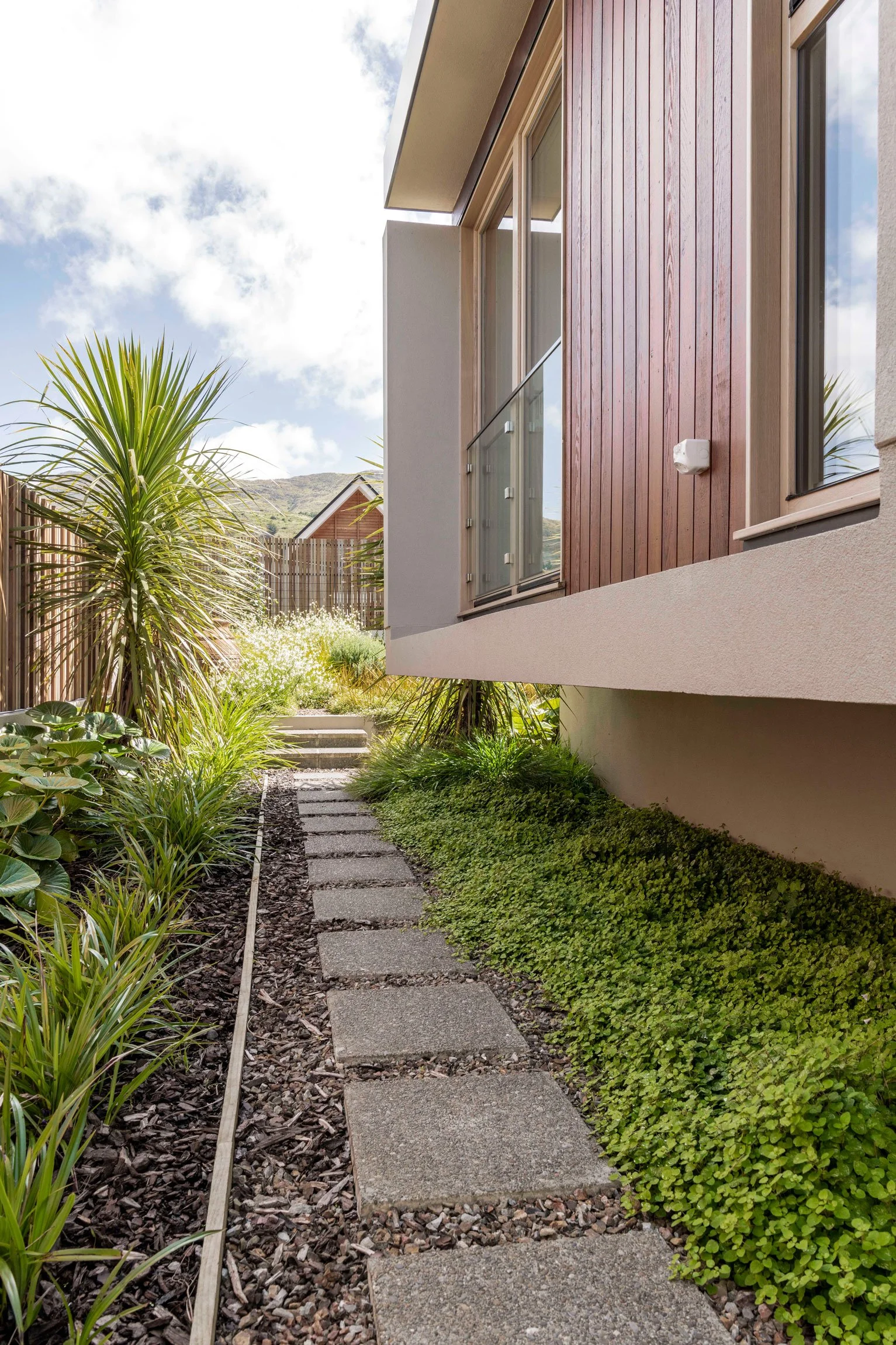Groundcover planting and stepping stones, by Botanic Landscape Architects in Lyttelton, Christchurch