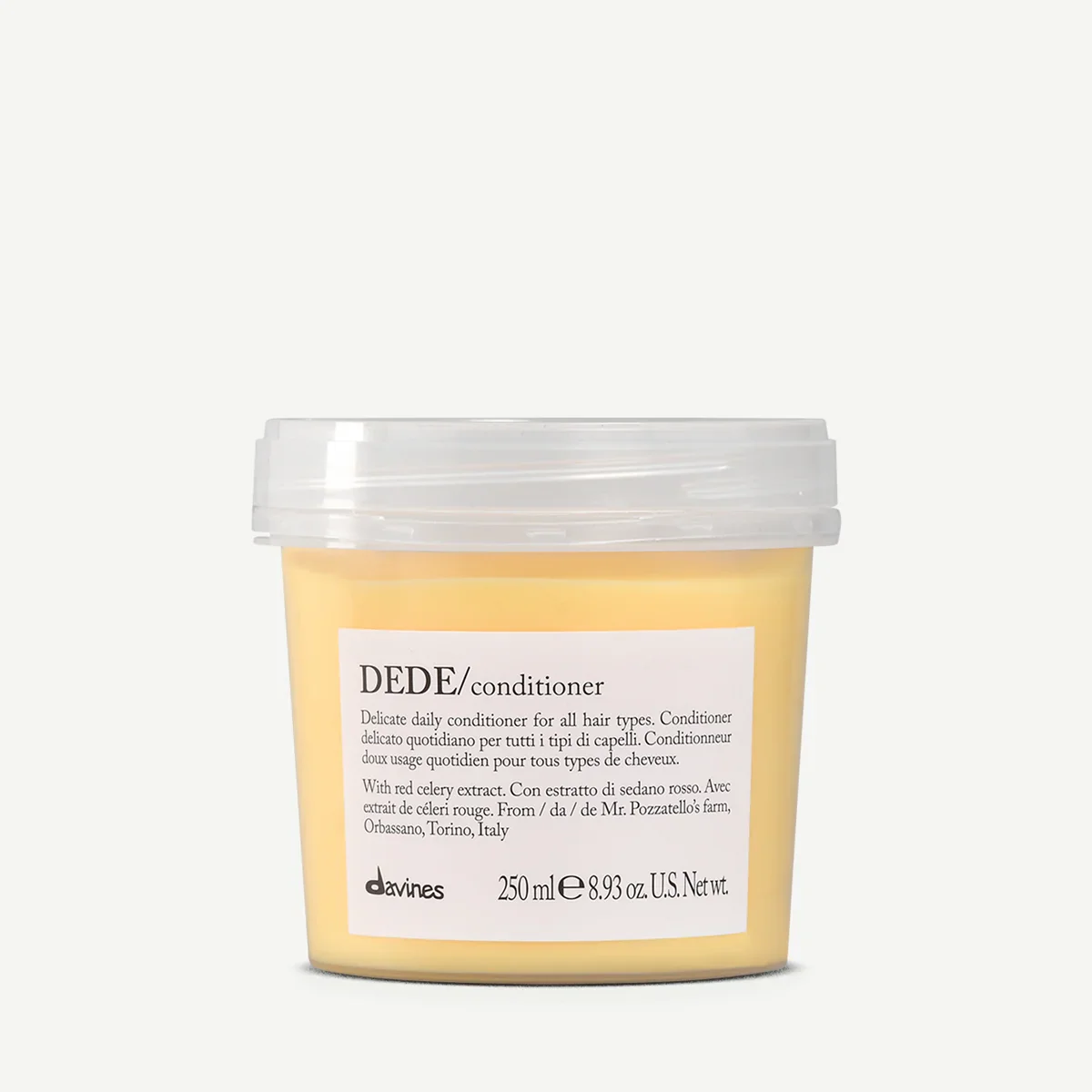 A yellow container of Davines Dede conditioner with a white label and clear lid, placed against a plain white background.