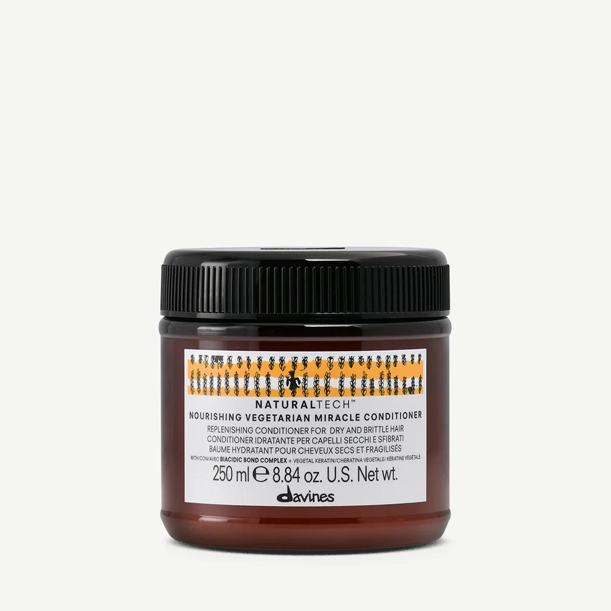 A jar of Davines Naturaltech Nourishing Vegetarian Miracle Conditioner with a black lid and brown body, label details include product name, size 250 ml or 8.84 oz, and description of hair conditioning benefits.