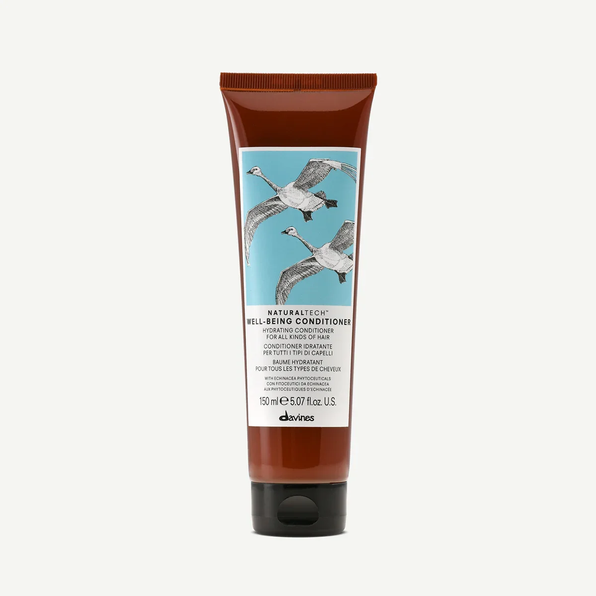 A tube of Davines Naturaltech Well-Being Conditioner with illustrated birds on the label.