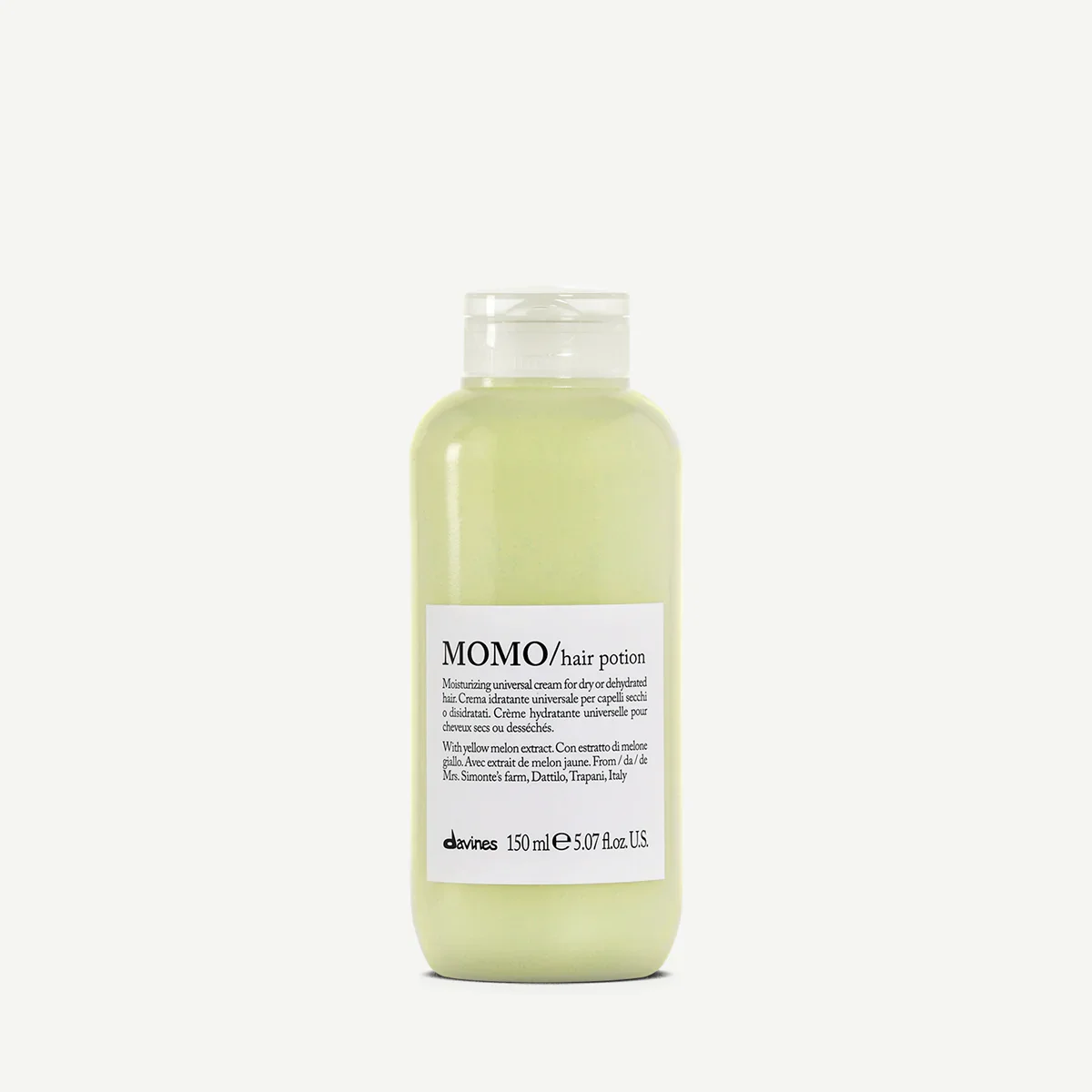 A bottle of MOMO hair potion with yellow melon extract, 150 ml capacity, placed against a plain white background.