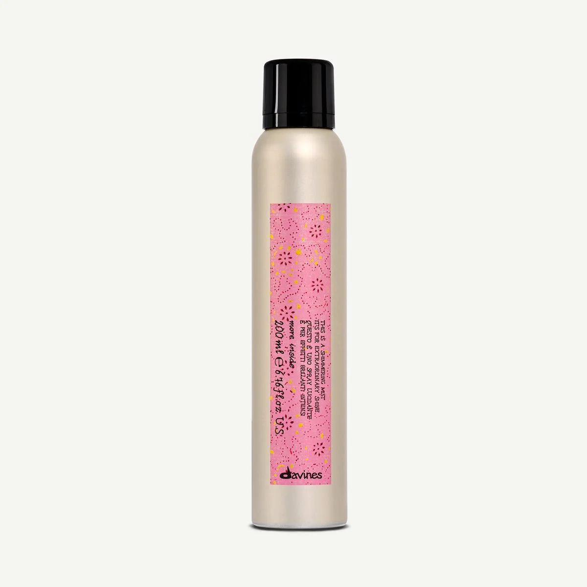 Silver aerosol spray can with a pink label featuring colorful confetti and floral patterns, black cap, and brand name 'Davines' at the bottom.